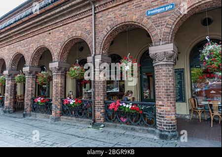 Oslo, Norway-July 26, 2013: tourists sit in a street cafe. Editorial. Stock Photo