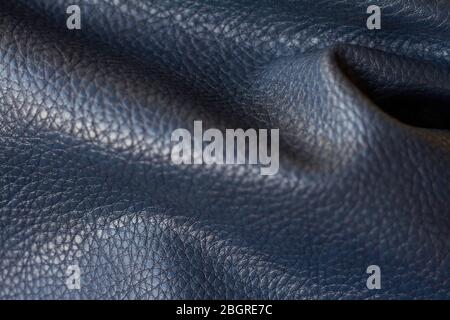 Close-up natural qualitative blue leather texture, selective focus Stock Photo