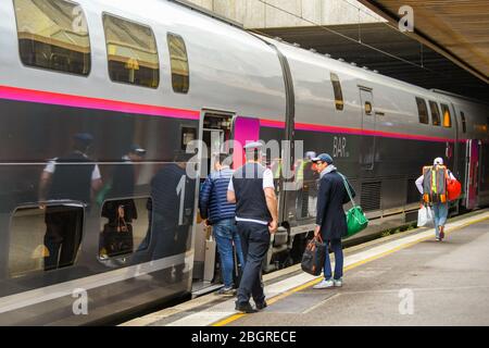 ST RAPHAEL, FRANCE - APRIL 2019: people boarding a TGV express train in St Raphael on the French Riviera. Stock Photo