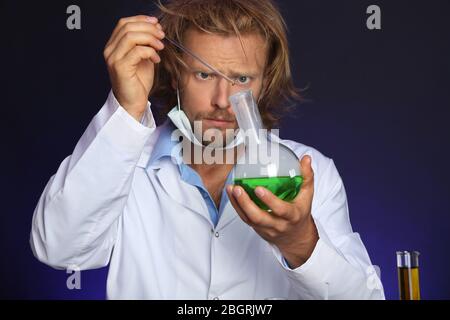 Crazy scientist working in laboratory Stock Photo
