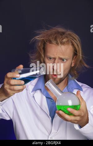 Crazy scientist working in laboratory Stock Photo