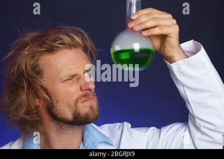 Crazy scientist working in laboratory Stock Photo