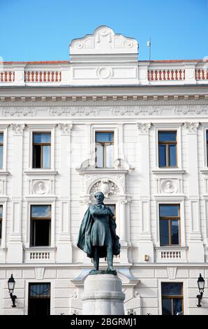 classical architectur building in Pecs, Hungary with Kossuth monument Stock Photo