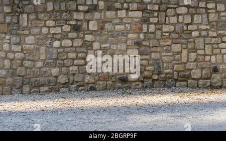 Traditional mediterranean wall made of natural stones Stock Photo