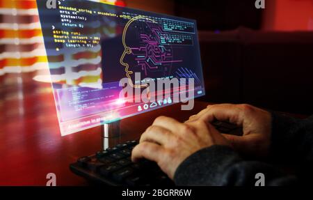 Artificial intelligence. Camera moves around hud display and man typing keyboard. Deep machine learning technology with cyber head shape. Digital AI f Stock Photo