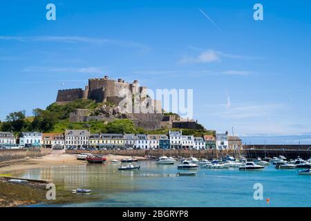 Mount Orgueil Castle overlooking the harbour and bay at Gorey on the east coast of Jersey, Channel Isles Stock Photo