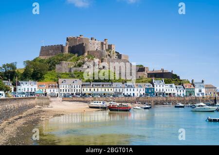 Mount Orgueil Castle overlooking the harbour and bay at Gorey on the east coast of Jersey, Channel Isles Stock Photo