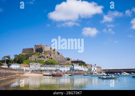 Mount Orgueil Castle overlooking the harbour and bay at Gorey on the east coast of Jersey, Channel Isles Stock Photo