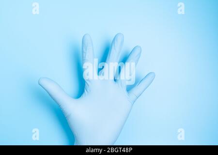 Male palm in medical latex glove Stock Photo