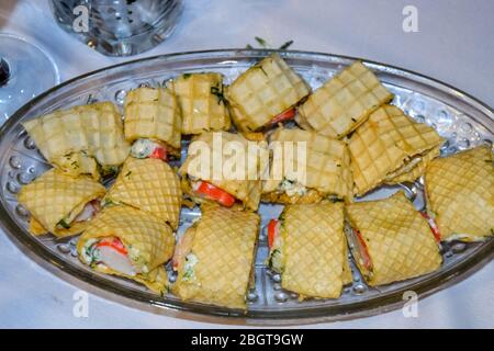 a Red caviar with mayonnaise in waffle rolls. Stock Photo