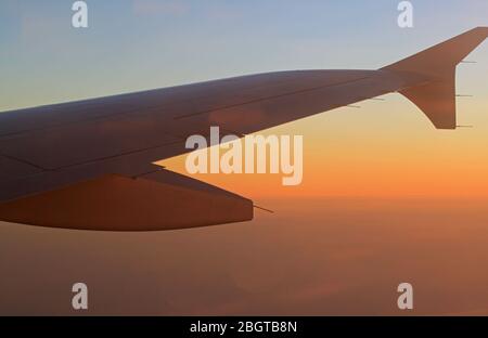 Airplane wing on the sky background. Sofia, Bulgaria - April 30, 2012: Passenger plane Airbus A320 flying to Beauvais airport Paris, France. Stock Photo