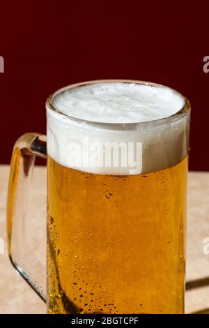 A pint of blonde beer, Ale or Lager, on a sunny day.  Colorful background Stock Photo