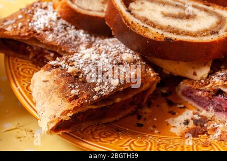 Tradition hungarian christmas cakes: beigli or bejgli. filled with nuts and strudels on a plate Stock Photo