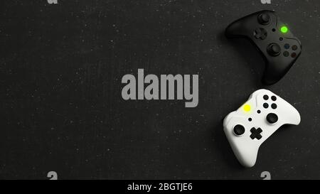 Game competition. White and black joystick with black stone background top view realistic 3D rendering Stock Photo