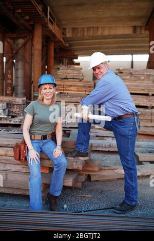 Portrait of male and female construction workers Stock Photo