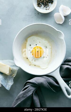 Fried Sunny Side Up Egg in Frying Pan Stock Photo
