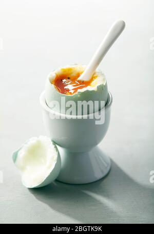 Soft Boiled Egg Cracked Open with Spoon Stock Photo