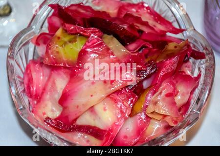 Cabbage leaf salad with beetroot. The salad is in a plate on the table. Stock Photo