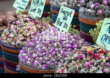 Dried herbal teas close-up. In the round box in front of the store. Healthy and delicious in different varieties and flavors. Stock Photo
