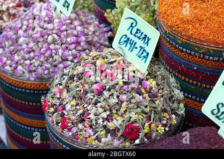 Dried herbal teas close-up. In the round box in front of the store. Healthy and delicious in different varieties and flavors. Stock Photo