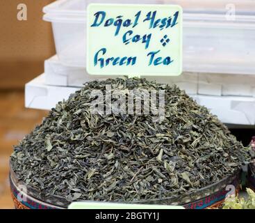 Dried herbal teas close-up. In the round box in front of the store. Healthy and delicious in different varieties and flavors. Stock Photo