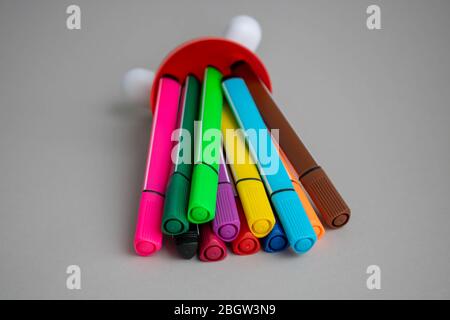 Lots of assorted colors marker pens isolated on gray background Stock Photo