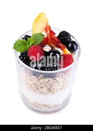 Healthy breakfast - yogurt with  fresh fruit, berries and muesli served in glass, isolated on white Stock Photo