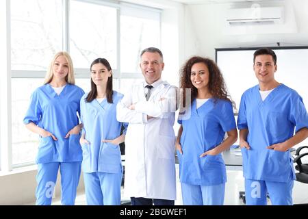 Male lecturer with medical students in university Stock Photo