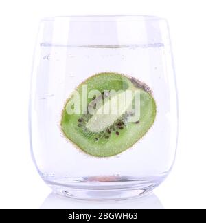 Kiwi in glass of water isolated on white Stock Photo