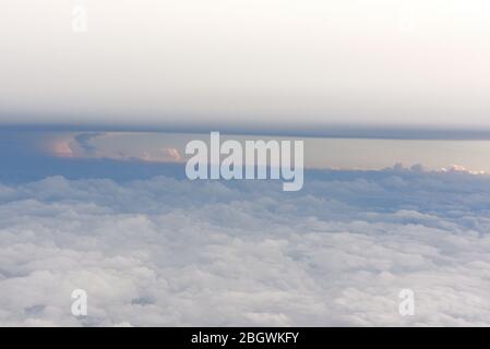 Horizontal image of a view of cloud formations from above, looking down from an airplane Stock Photo