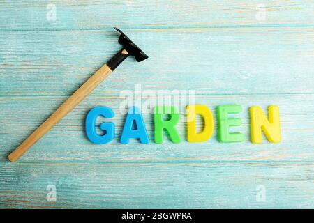 Garden word formed with colorful letters on wooden background Stock Photo