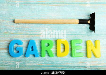 Garden word formed with colorful letters on wooden background Stock Photo