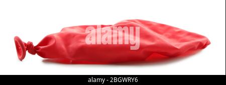 Popped red balloon isolated on white Stock Photo