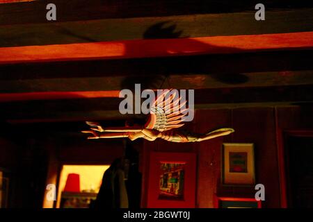 mysterious woman flies across the room with strong chiaroscuro, Stock Photo