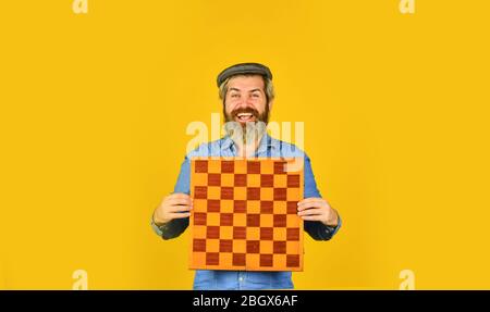 Board game. Strategy concept. Chess competition. Thoughtful bearded man play chess. Chess figure. Intellectual game. Enjoy tournament. Grandmaster player. Chess lesson. Cognitive development. Stock Photo