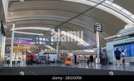 Inside Toronto Pearson Intl. Airport, Terminal 1 by the check-in desks on a busy afternoon. Stock Photo