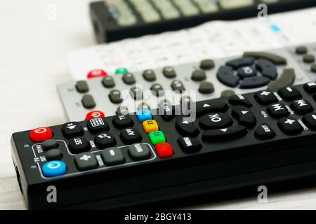 Many remote control devices on table Stock Photo