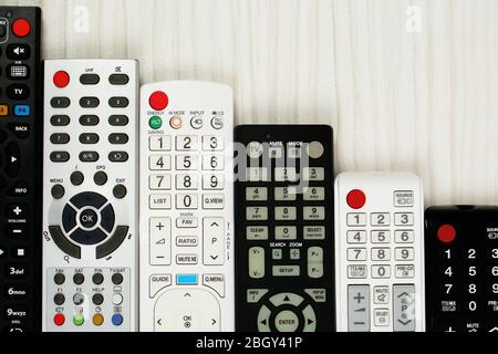 Many remote control devices on table Stock Photo