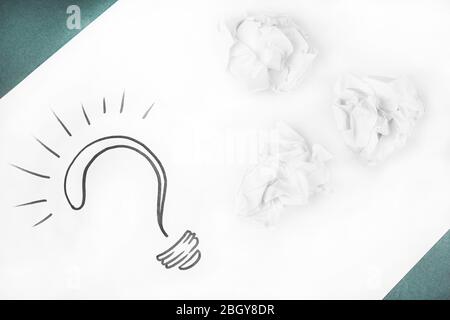 Question mark on sheet of paper on color table background Stock Photo