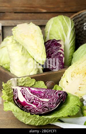 Still life with assortment cabbages on wooden background Stock Photo