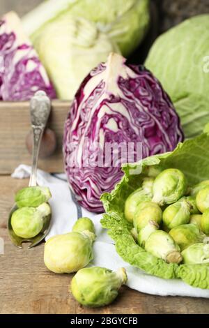 Still life with assortment cabbages on wooden background Stock Photo