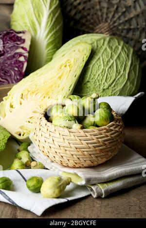 Still life with assortment cabbages on wooden background Stock Photo