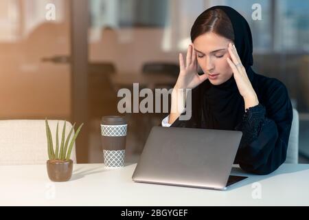 professional young female muslim worker having problem Stock Photo