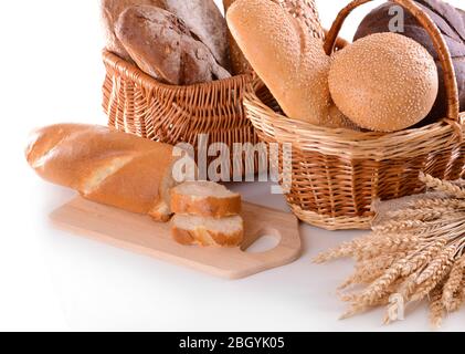 Different bread in wicker baskets isolated on white Stock Photo
