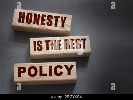 Honesty is the best policy Words Written In Wooden blocks. Trustworthy, truth, beliefs and agreement business concept Stock Photo