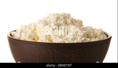 Cottage cheese in clay bowl isolated on white Stock Photo