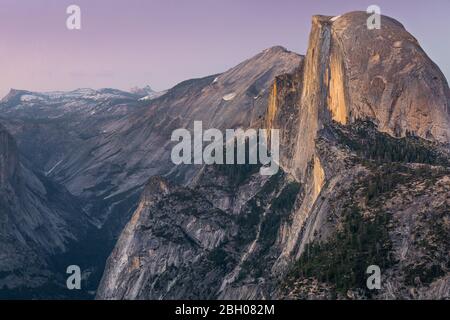 Close up shot at dusk of the Half Dome peak, in Yosemite National Park, as seen from the Glacier Point