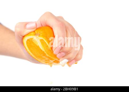 Female hand squeezing orange isolated on white Stock Photo