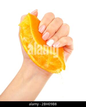 Female hand squeezing orange isolated on white Stock Photo