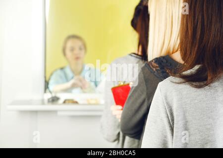 Teller window with working cashier Stock Photo